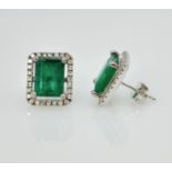 Pair of 18ct emerald and diamond cluster ear-rings, emeralds approx 4.8 carat, diamonds 0.