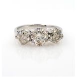 White gold three stone diamond ring stamped 18ct diamonds 1.