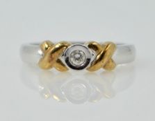 9ct white gold ring set with single diamond with yellow gold criss-cross detail hallmarked