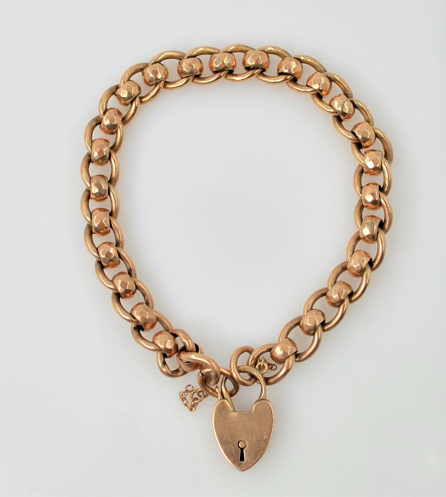 Edwardian rose gold fancy link bracelet with heart shaped lock Birmingham 1908 approx 16.