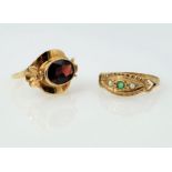 Gold garnet set ring with flower detail and a gold emerald and seed pearl ring both hallmarked 9ct