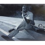 Peter J Bailey (British 1951-): Jazz Theme - 'Sax on the Street', oil on canvas,