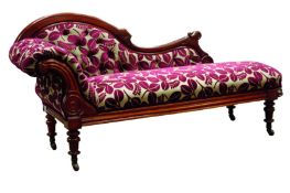Late Victorian walnut framed chaise longue, scrolled buttoned back with carved detail,