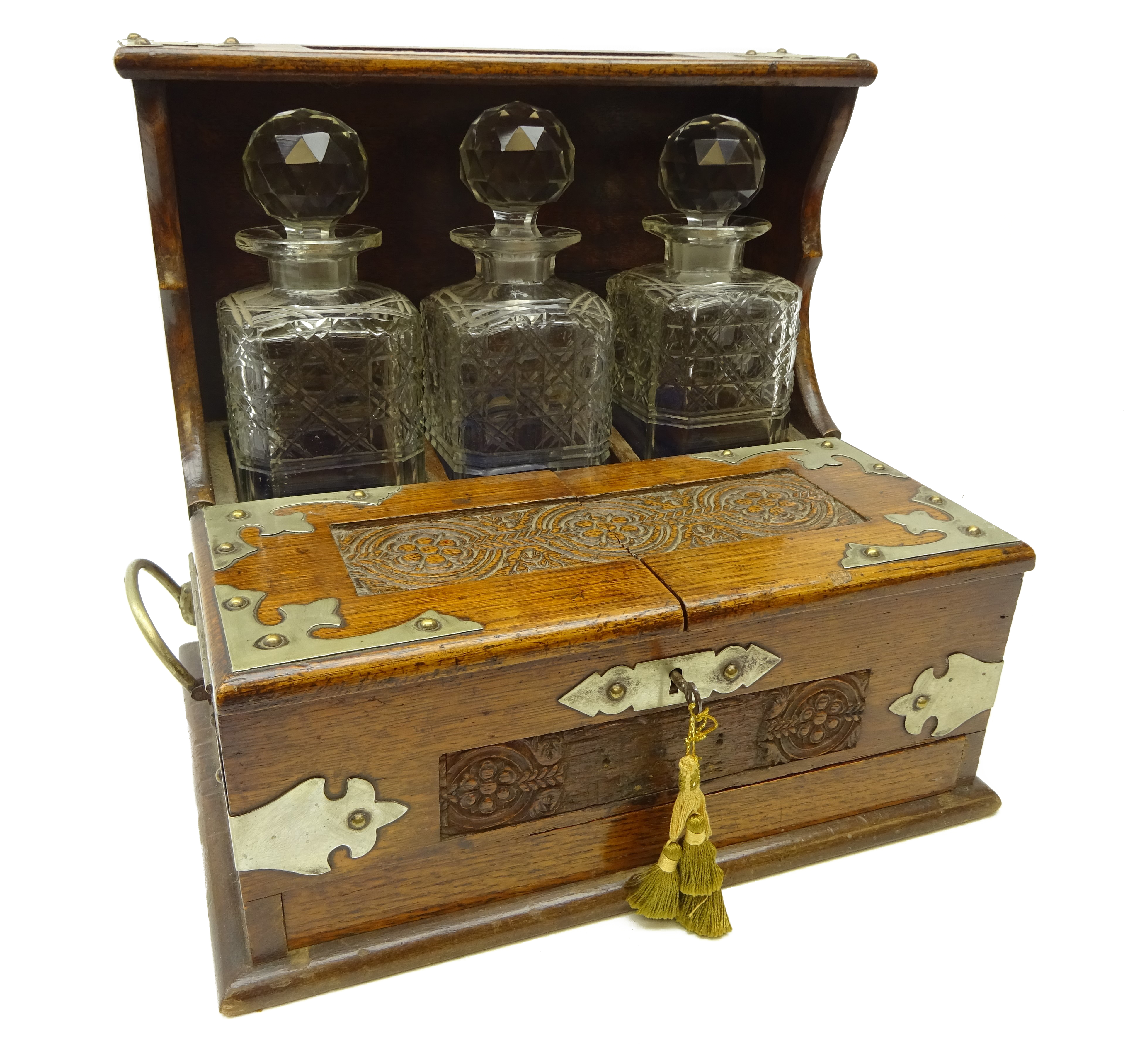 Edwardian oak three bottle tantalus with silver-plated mounts, carved floral panels, - Image 3 of 3
