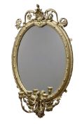 20th century ornate gilt wood and gesso framed oval mirror with three candle sconces,