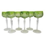 Set of six lime green overlay cut hock glasses, faceted stems and star cut base, H19.