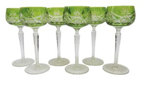 Set of six lime green overlay cut hock glasses, faceted stems and star cut base, H19.