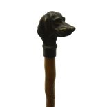 Early 20th century Malacca walking cane with carved spiralled decoration and brass pommel moulded