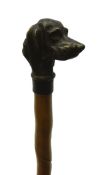 Early 20th century Malacca walking cane with carved spiralled decoration and brass pommel moulded