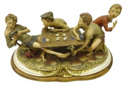 Large Capodimonte figure 'The Cheats' by Bruno Merli on shaped plinth,