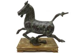 20th Century Chinese Tang Dynasty style bronze Flying Horse of Gansu, on hardwood base,