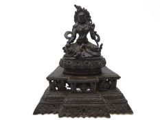 Bronze figure of Guanyin, seated in a mediative pose, with flowing robes,