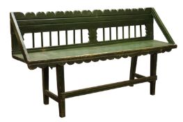 Early 19th century country green painted bench, shaped top rail above spindle back, plank seat,