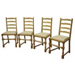 'Squirrelman' set four oak ladder back dining chairs, turned supports, upholstered drop in seats,