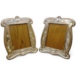 Pair of Art Nouveau silver on oak freestanding photograph frames,