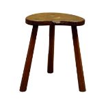'Mouseman' oak three legged stool, dished adzed seat, by Robert Thompson of Kilburn,