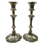 Pair Victorian Sheffield plate candlesticks with foliate scroll decoration and fluted stem,