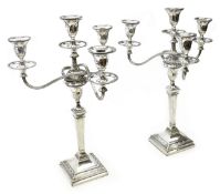 Pair Edwardian Adam style silver three branch candelabra,