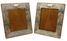 Pair of Art Nouveau silver and enamel on oak freestanding photograph frames by A & J Zimmerman Ltd
