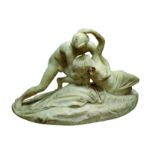 20th century white marble figure group of an angel holding lightly draped female figure,