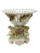 German Sitzendorf porcelain centrepiece, the pierced basket applied with fruit and trailing flowers,