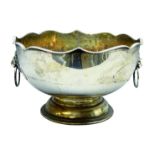 Silver-plated footed punch bowl with lion mask loop handles and shaped top,