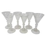 Set of six 19th century wine glasses, the faceted trumpet bowls on triple knop stems,