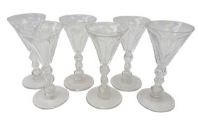 Set of six 19th century wine glasses, the faceted trumpet bowls on triple knop stems,