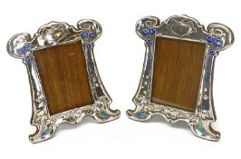 Pair of Art Nouveau silver and enamel on oak photograph frames by Walker & Hall 1906,