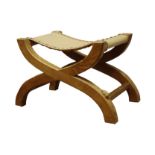 'Rabbitman' curved x-framed stool with slung leather seats,