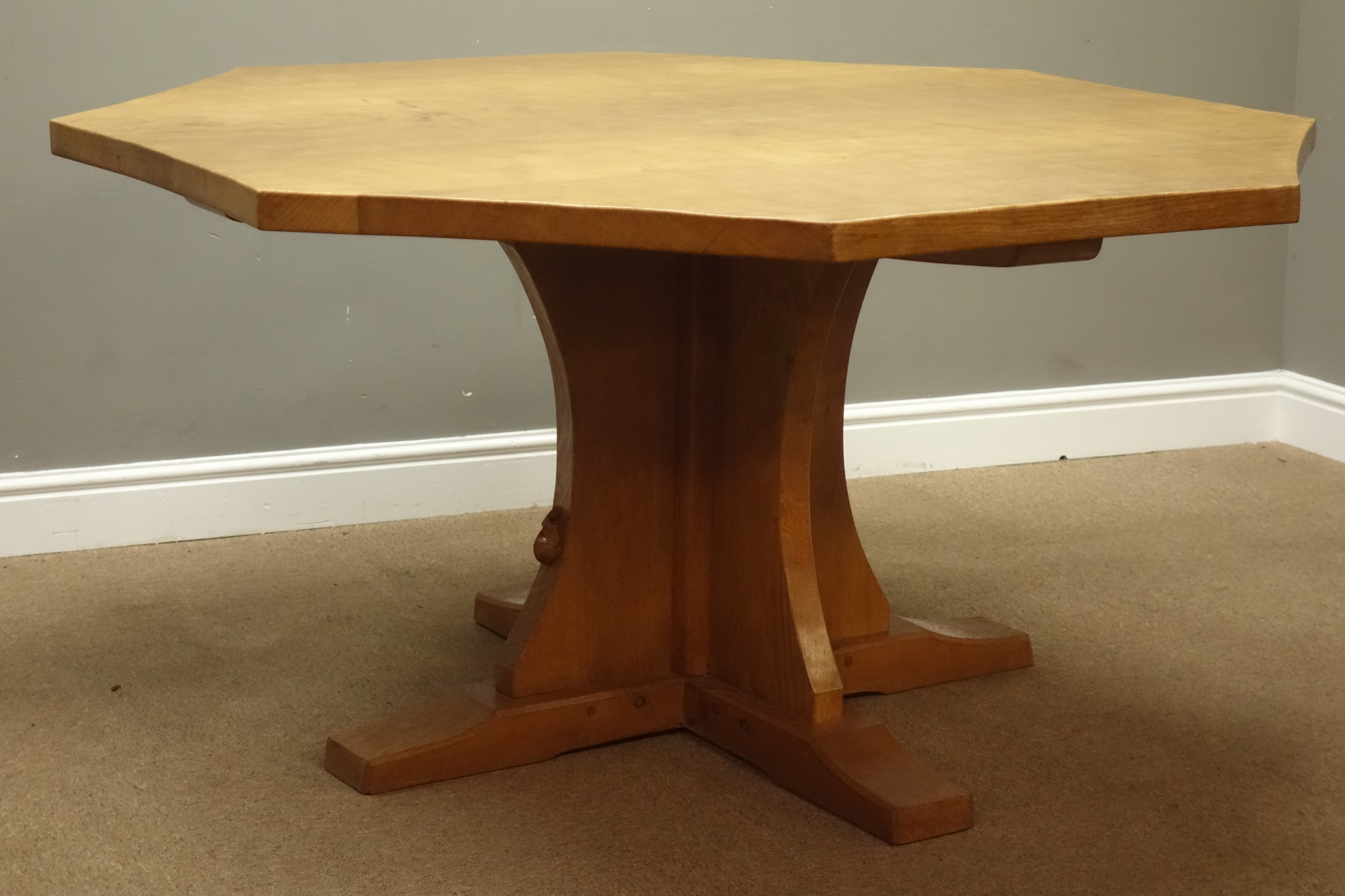 'Mouseman' adzed oak octagonal top dining table, on cruciform base, by Robert Thompson of Kilburn,