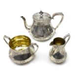 Victorian silver tea set with engraved decoration and gilt interior by Henry Holland, London 1870,