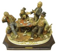 Large Capodimonte 'Old Cheats' depicting a group of four gentlemen gathered around a table playing