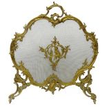 French Rococo style gilt metal fire screen, cartouche shaped ornate scrolling frame and supports,