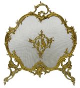 French Rococo style gilt metal fire screen, cartouche shaped ornate scrolling frame and supports,