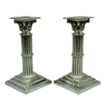 Pair late 19th century silver-plated Corinthian column shaped candlesticks on stepped bases,