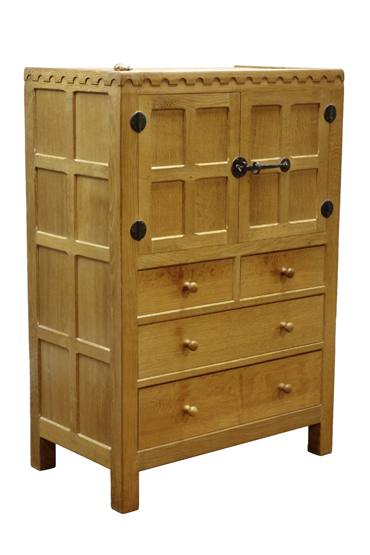 'Mouseman' panelled oak tallboy, cupboard above two short and two long drawers,