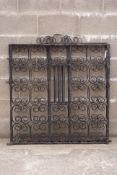 Pair of wrought scroll work metal driveway gates fitted with latch, W212cm,