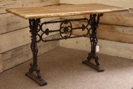 Rectangular hardwood top table on ornate cast iron base, 119cm x 60cm,