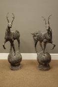 Pair cast metal garden stags on spherical mounts, figures/gate post finials,