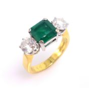 Emerald and diamond three stone gold ring, hallmarked 18ct emerald approx 2 carat, each diamond 0.