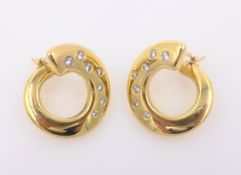 Pair of 18ct gold diamond set ear-rings,
