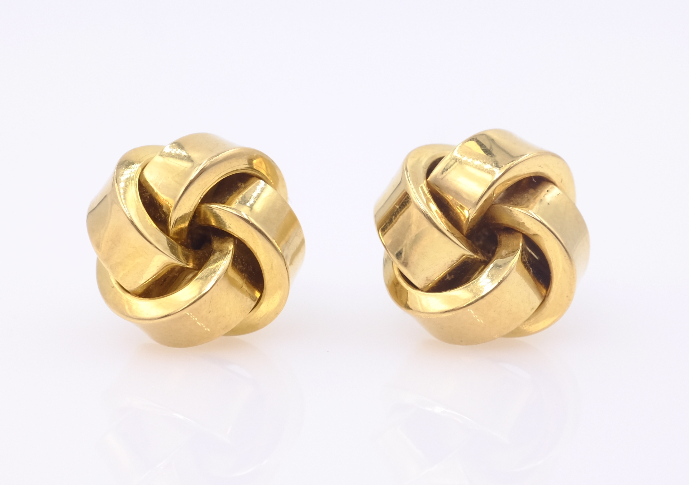 Pair of gold knot ear-rings, hallmarked 14ct approx 3.