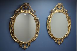 Pair gilt framed wall mirrors, scalloped shell surround with acanthus leaf and scrolls,