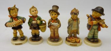Five Goebel Hummel figures; 'Village Boy', 'Accordion Boy', 'Little Fiddler',