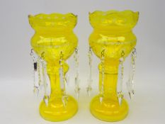 Pair 20th century Bohemian yellow tinted glass lustres, with star cut decoration,