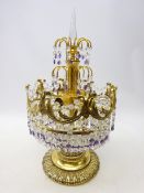 Gilt metal table lamp hung with three tiers of clear and amethyst crystal drops,