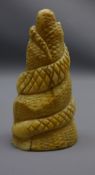 19th century Japanese carved ivory okimono, carved as a snake coiled around a rock,