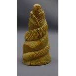 19th century Japanese carved ivory okimono, carved as a snake coiled around a rock,