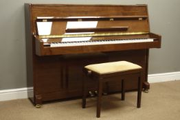 'Steinbach' upright piano in walnut finish case, iron framed and overstrung with damper pedal,